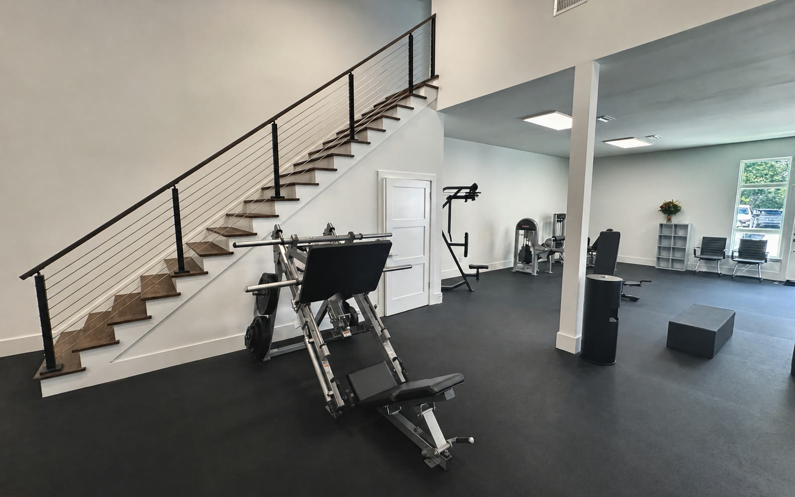 The staircase and open training floor inside the Solstice studio.